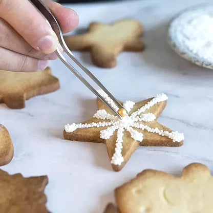 Pinzas profesionales de cocina de acero inoxidable para decorar alimentos.