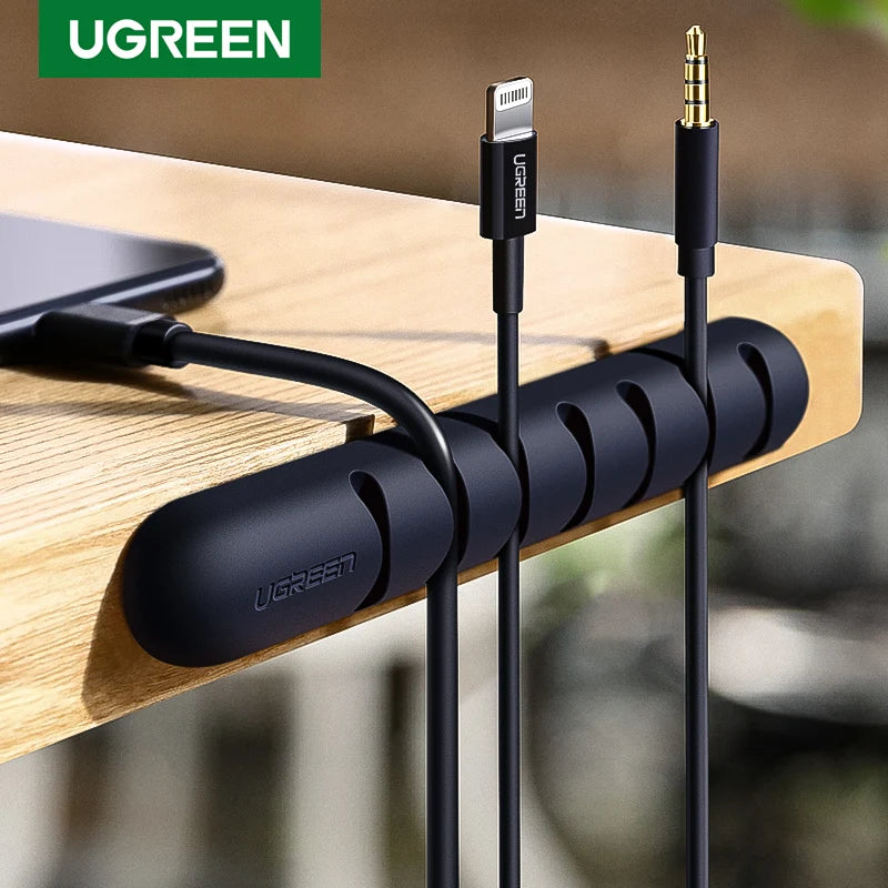Organizador de cables de silicona con adhesivo para escritorio, veladores, y muebles en general.