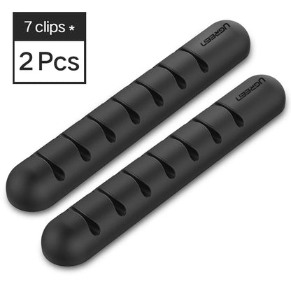 Organizador de cables de silicona con adhesivo para escritorio, veladores, y muebles en general.